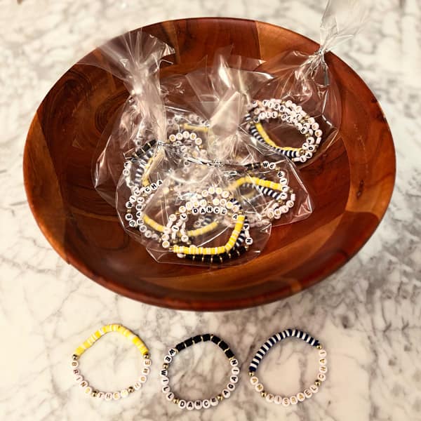 Friendship bracelets in a wooden bowl